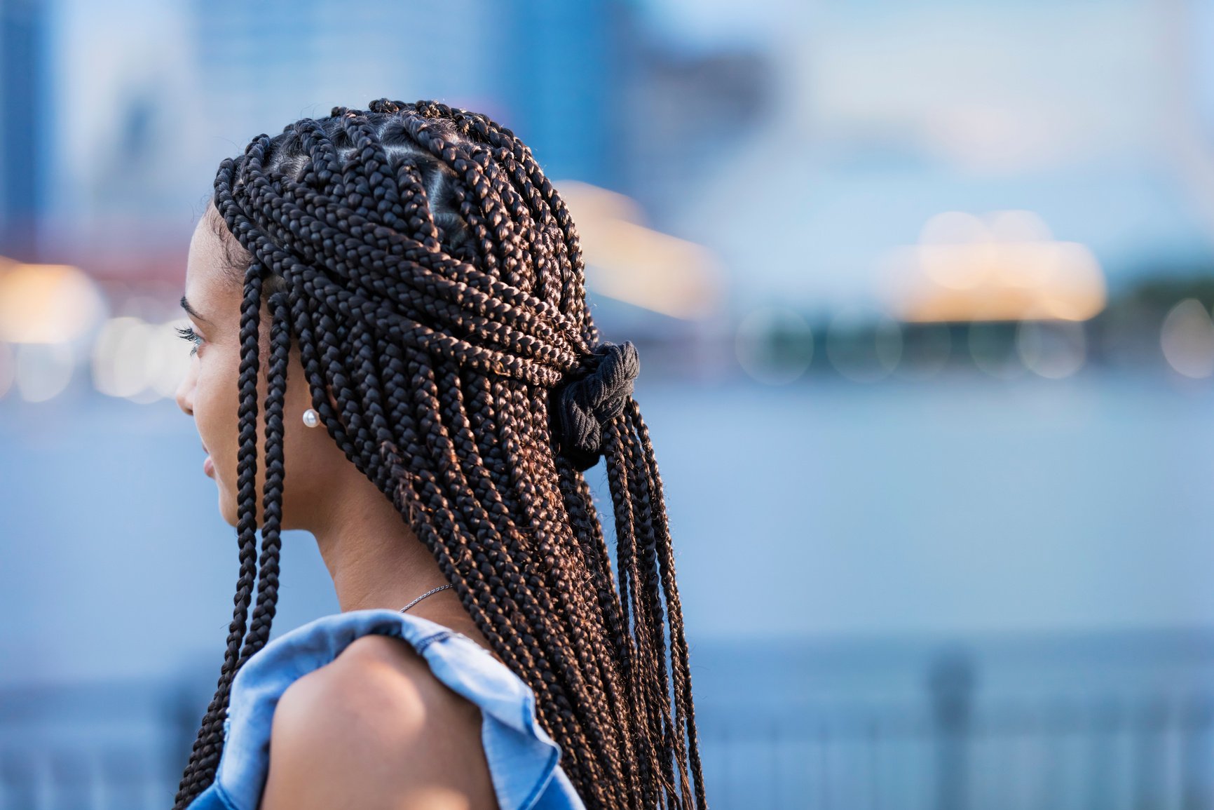 Young mixed race woman with cornrow braids